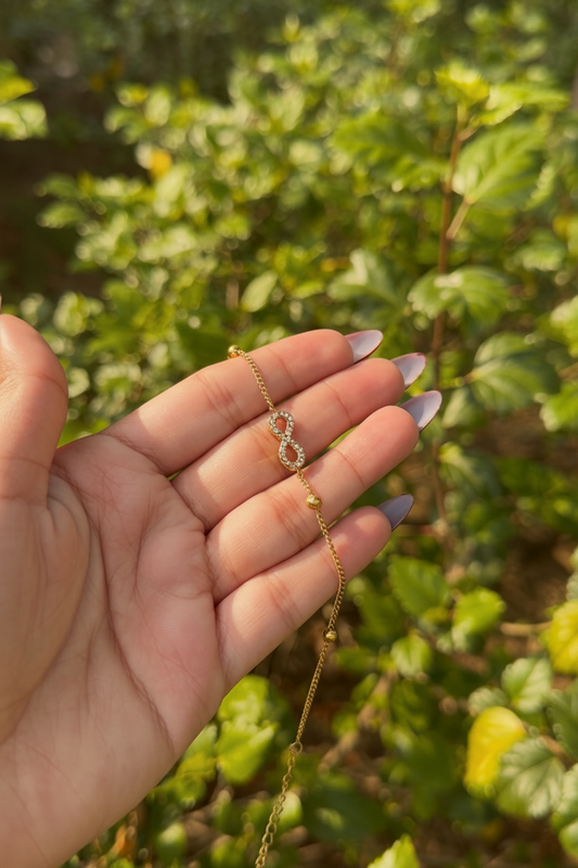 18K Gold Infinity Bracelet on wrist