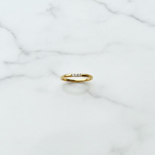 Lumora Ring flat lay on white marble surface