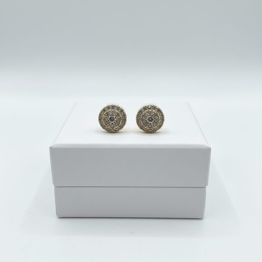 Pavé cluster stud earrings on white jewelry box