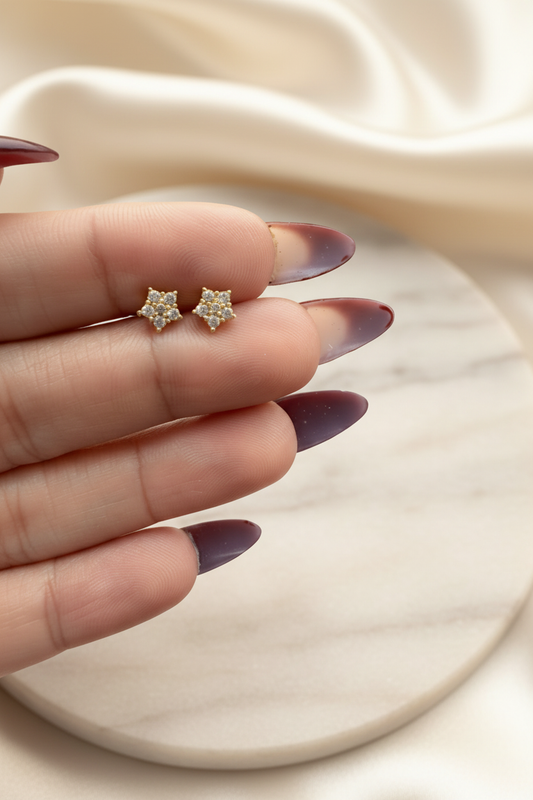 Lil Luxe Flower Studs on marble silk background