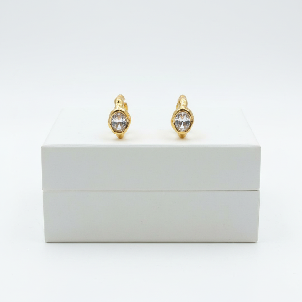 Lumière Solitaire Hoops on white jewelry box