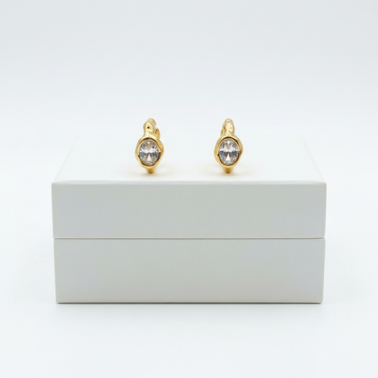Lumière Solitaire Hoops on white jewelry box