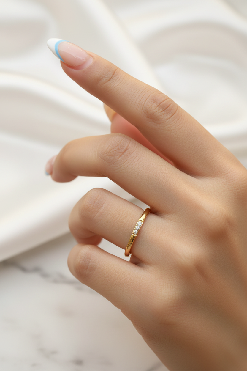 Lumora Ring on raised hand with white satin marble background