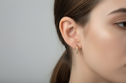 Natalia Hoop CZ huggie earrings on model ear