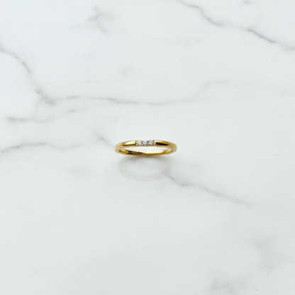 Lumora Ring flat lay on white marble surface