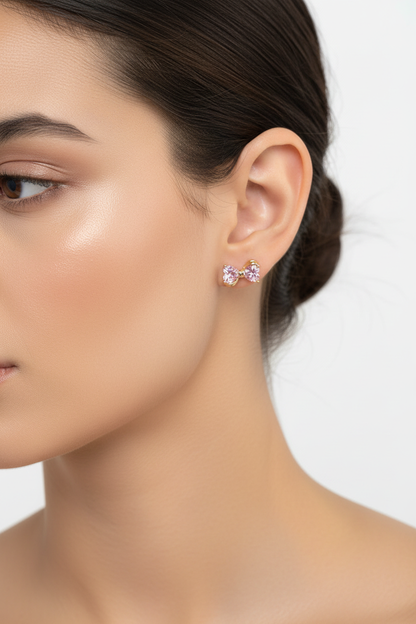 Crystal bow earrings worn on ear