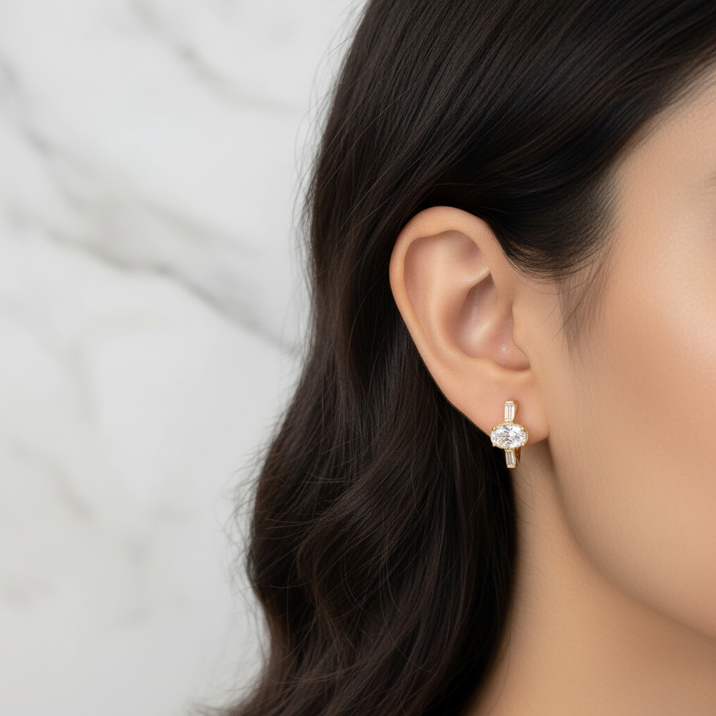 Sterling Huggies triple stone CZ earring on model ear white marble