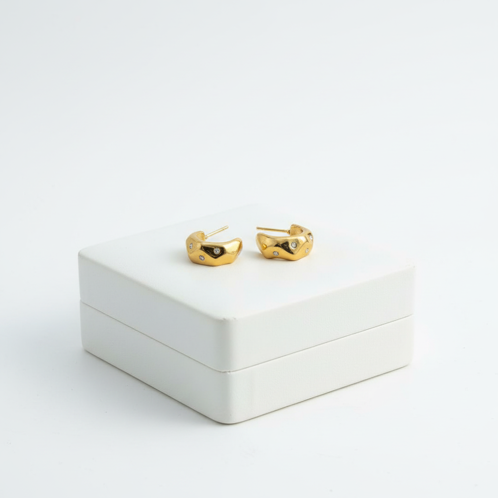 Molten Gold Crystal Hoops on white jewelry box