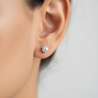 Close-up of CZ solitaire stud earring on earlobe