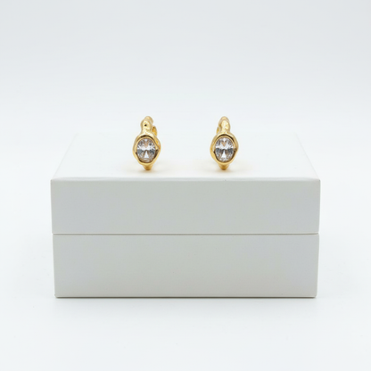 Lumière Solitaire Hoops on white jewelry box
